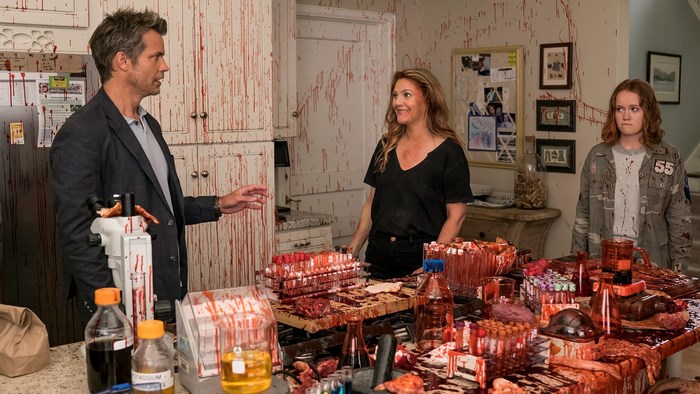 Drew Barrymore and two others in a bloody room