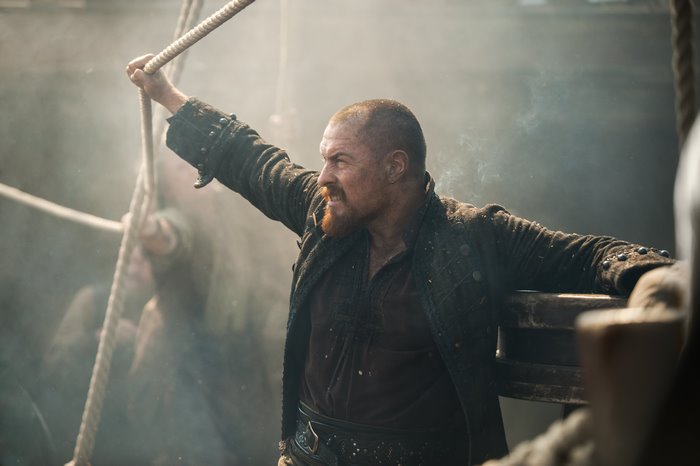 Toby Stephens as Captain Flint on a ship