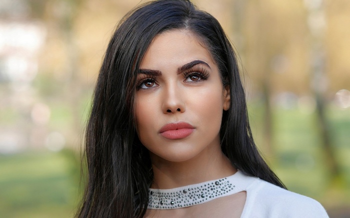 Woman with dark hair and makeup
