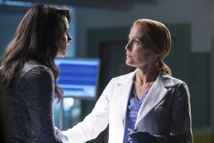 Gillian Anderson in a lab coat
