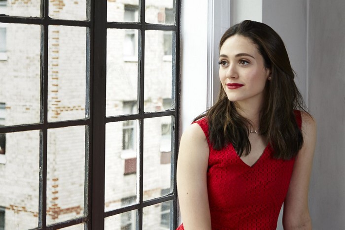 Emmy Rossum by a window