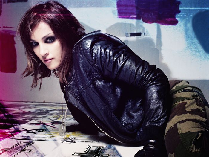 Madonna in leather jacket and camouflage pants