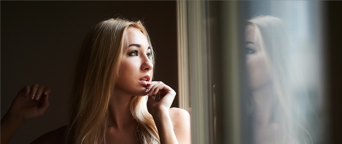 Woman looking out a window