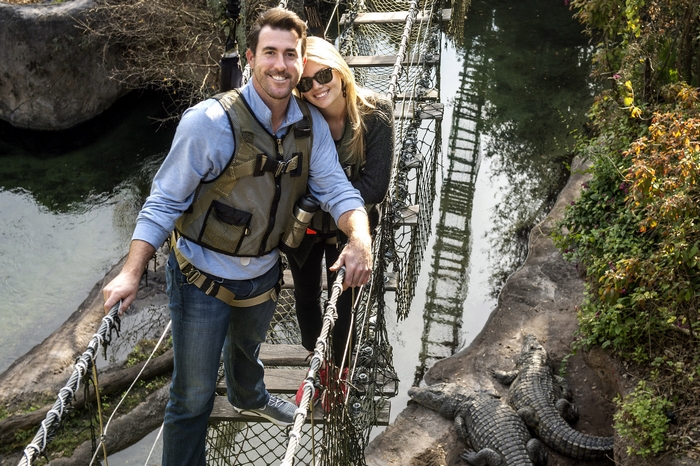 Kate Upton on a suspension bridge with alligators