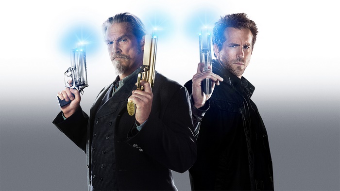Jeff Bridges and Ryan Reynolds holding guns