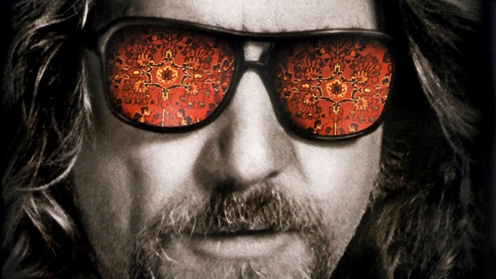 Jeff Bridges wearing sunglasses reflecting a rug