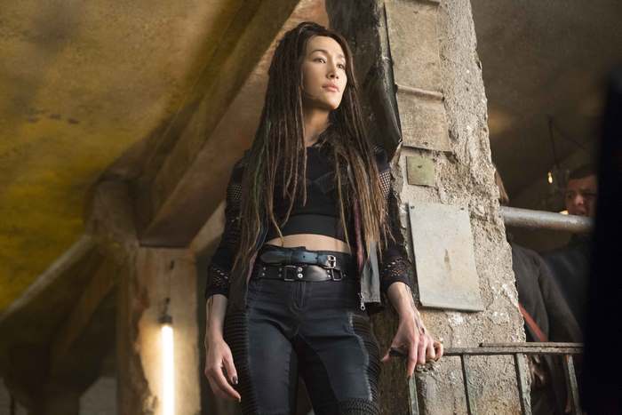 Maggie Q in a dark, industrial setting