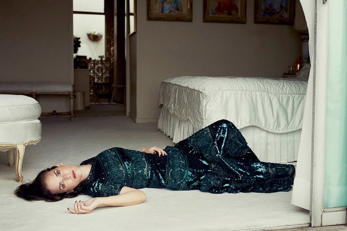 Winona Ryder lying on floor in sequined dress