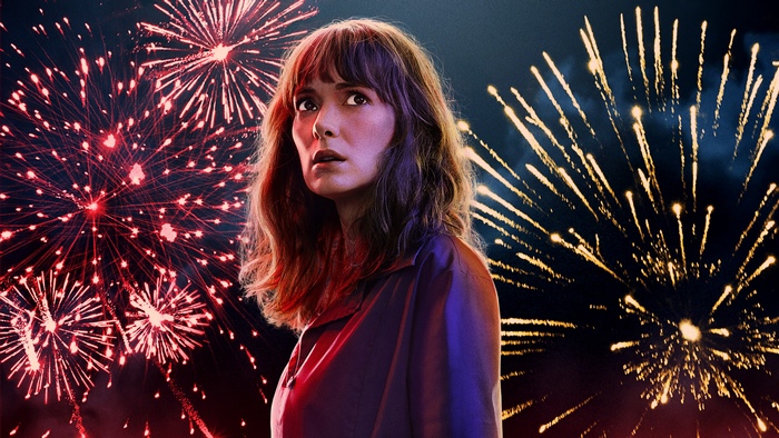 Winona Ryder in front of fireworks
