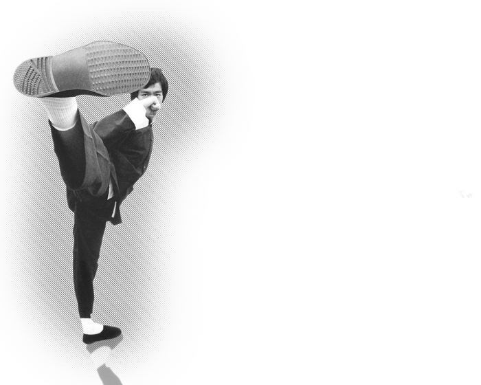 Bruce Lee performing a high kick