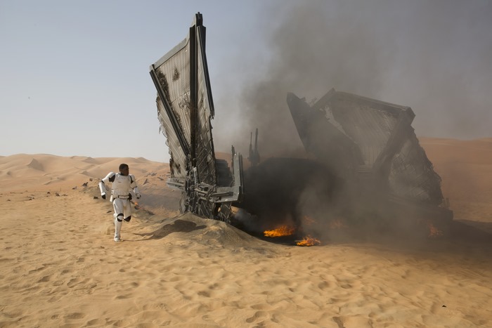 Finn from Star Wars in a desert crash site