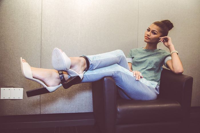 Zendaya sitting in a chair
