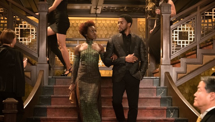 Chadwick Boseman and Lupita Nyong'o on stairs