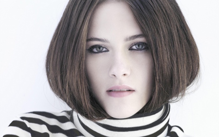 Woman with bob haircut and striped turtleneck