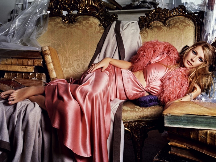 Gwyneth Paltrow on a vintage couch