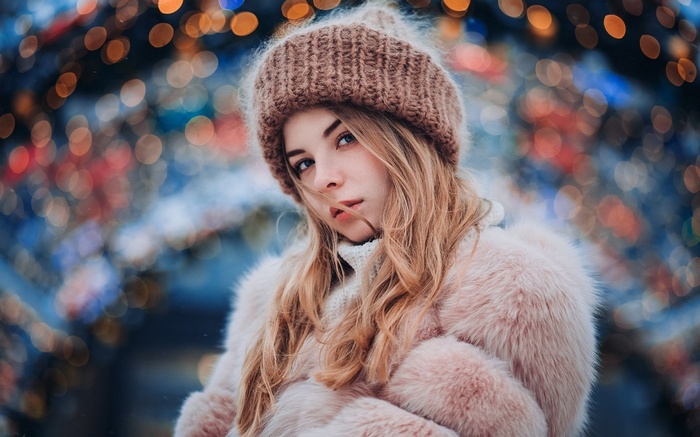Woman in winter hat and fur coat