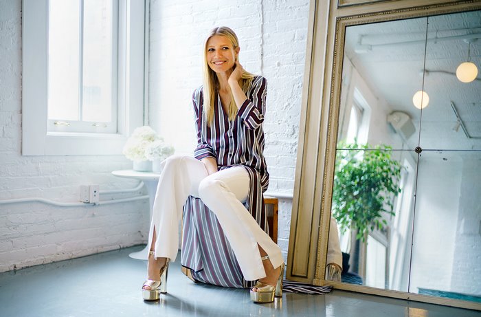 Gwyneth Paltrow in striped shirt and white pants