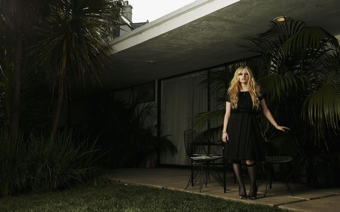 Avril Lavigne in a black dress