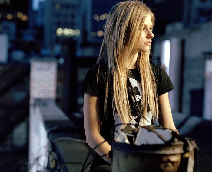 Avril Lavigne on a rooftop at night