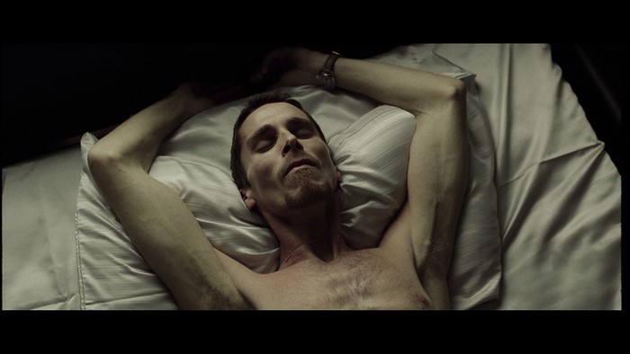 Christian Bale lying in bed