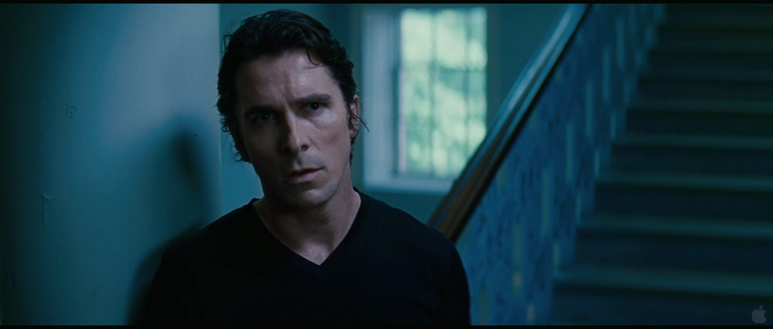 Christian Bale in a dark room
