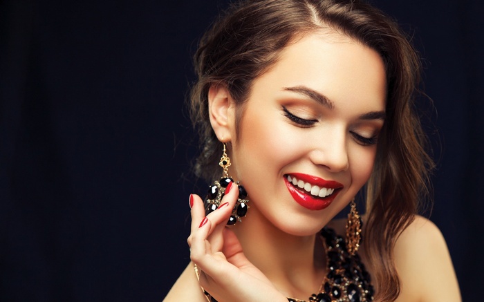 Woman with red lipstick and large earrings