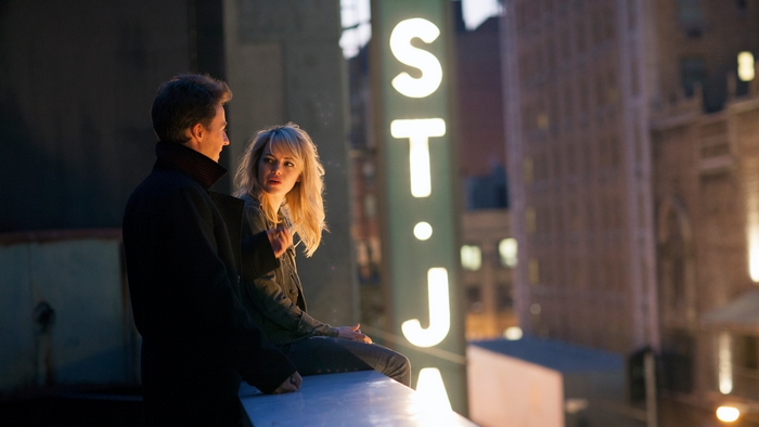 Edward Norton and Emma Stone on a rooftop