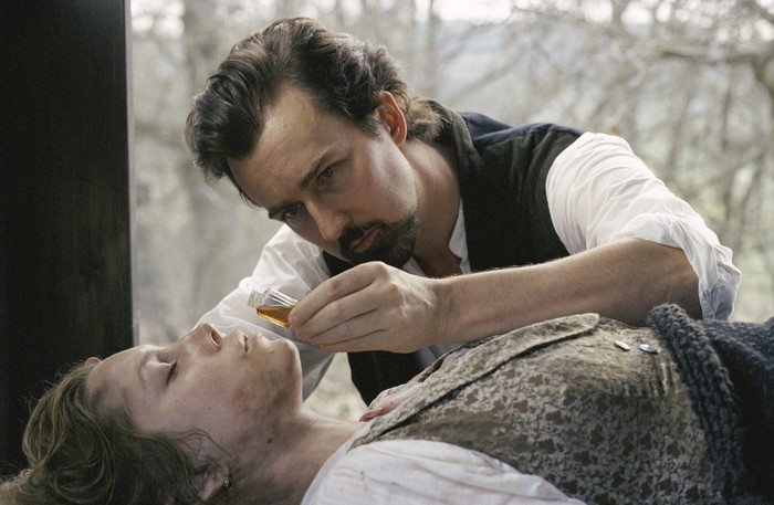 Edward Norton administering liquid to a person