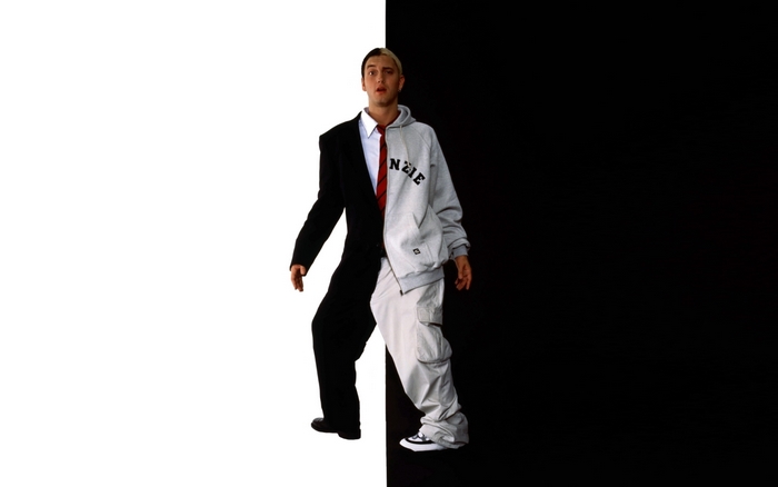 Eminem in a split suit and hoodie