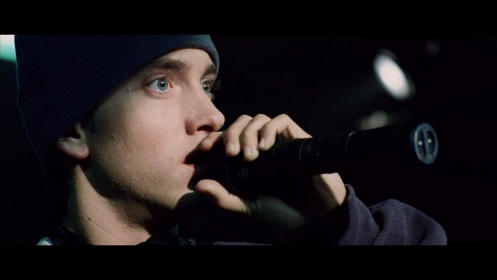 Eminem performing with a microphone