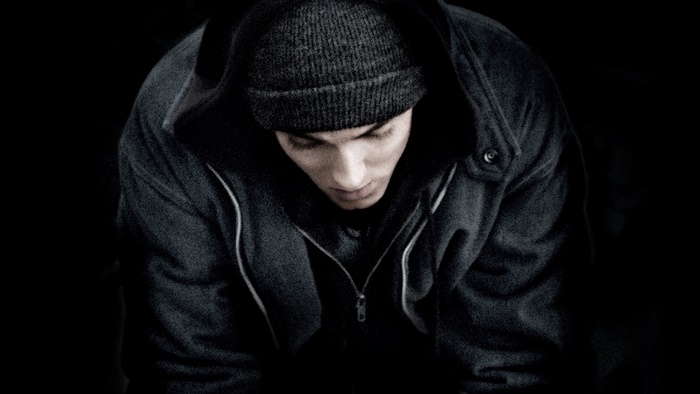 Eminem wearing a beanie and hoodie