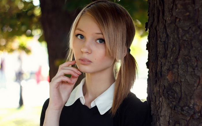 Young woman with blonde hair in pigtails
