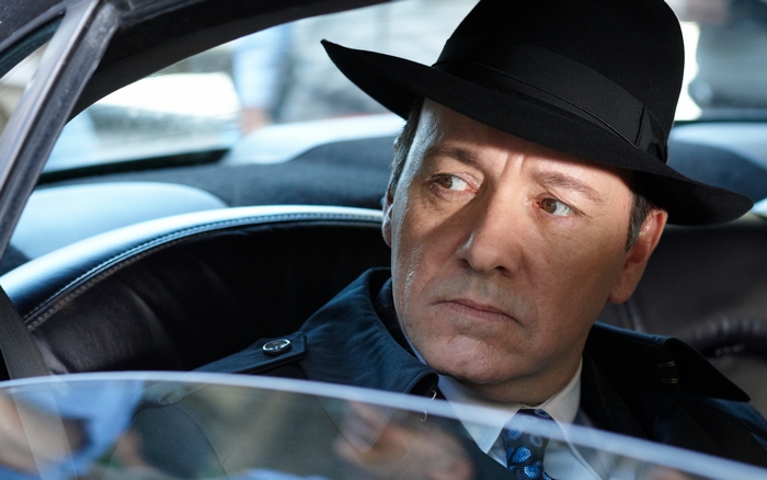 Kevin Spacey in a car wearing a fedora
