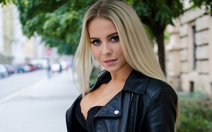 Woman in leather jacket on a street