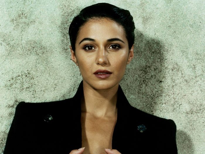 Naomi Scott in a black jacket