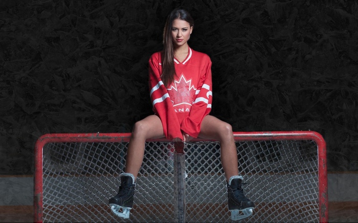 Woman in Canadian Hockey Jersey on Goal Net