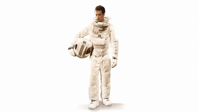 Sam Rockwell in a spacesuit holding a helmet