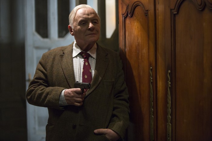 Anthony Hopkins holding a gun