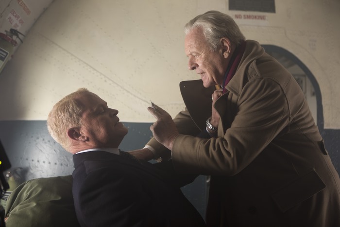 Anthony Hopkins and another man on a plane