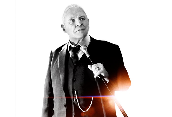 Anthony Hopkins in a suit holding a cane