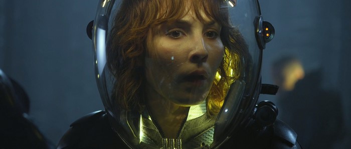 Noomi Rapace in a futuristic helmet