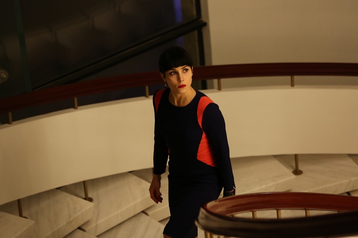 Noomi Rapace on a Staircase