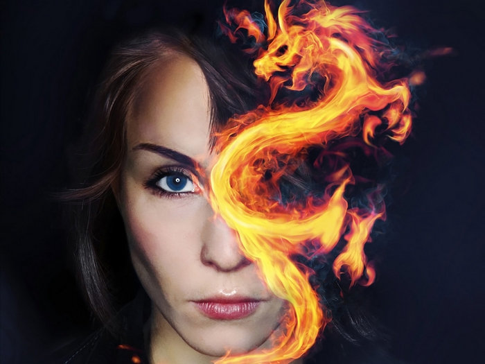 Woman with a fire dragon over her face