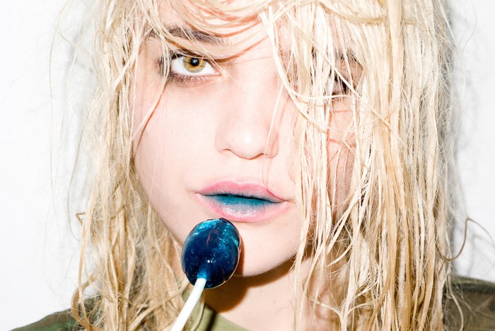 Sky Ferreira with blue lipstick and lollipop
