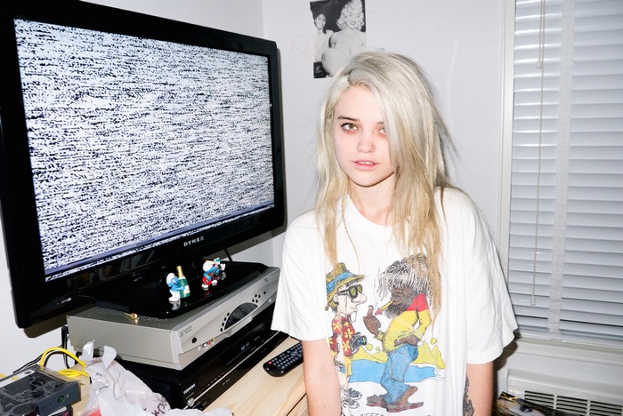 Sky Ferreira in front of a static TV