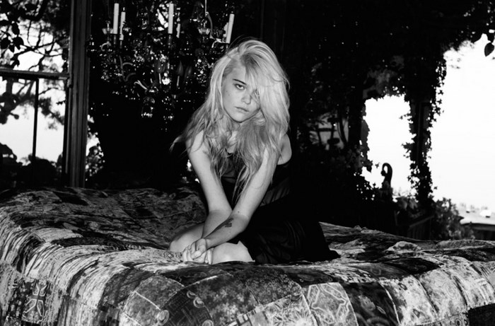 Sky Ferreira on a bed