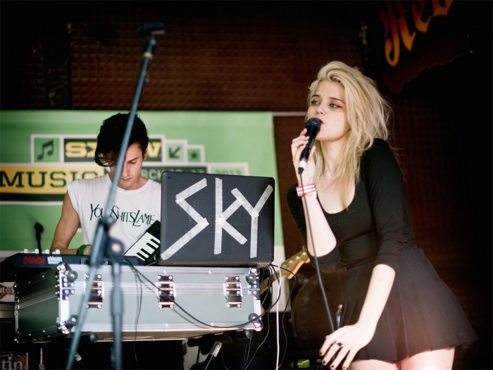 Sky Ferreira performing music on stage