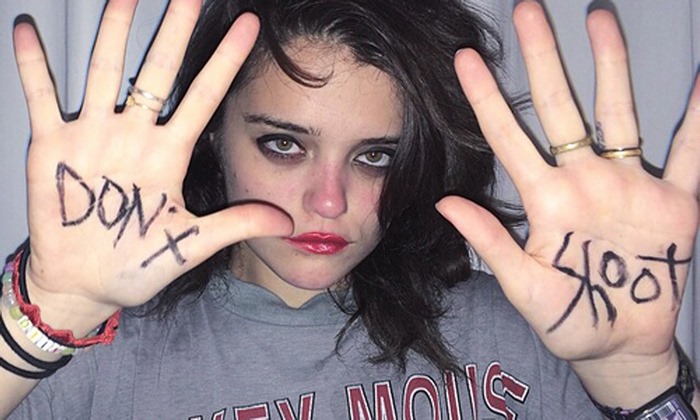 Sky Ferreira with 'Don't Shoot' on hands