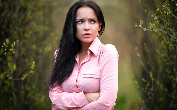 Woman in pink shirt outdoors