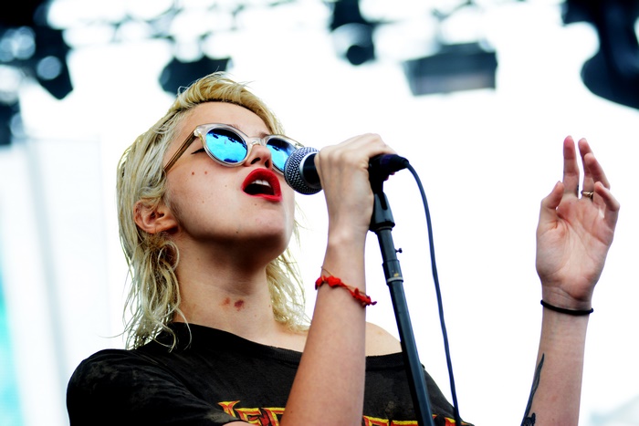 Sky Ferreira singing into a microphone